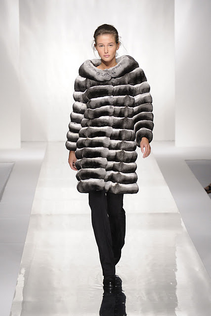 Woman wearing Carlo Ramello black white grey coat