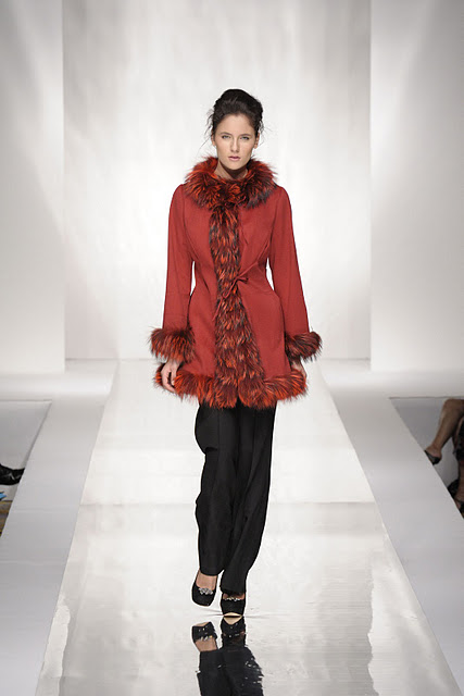 Woman with red fur vest