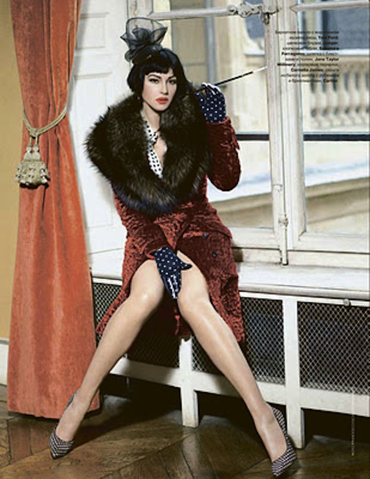 Monica Bellucci wearing red and black fur vest 