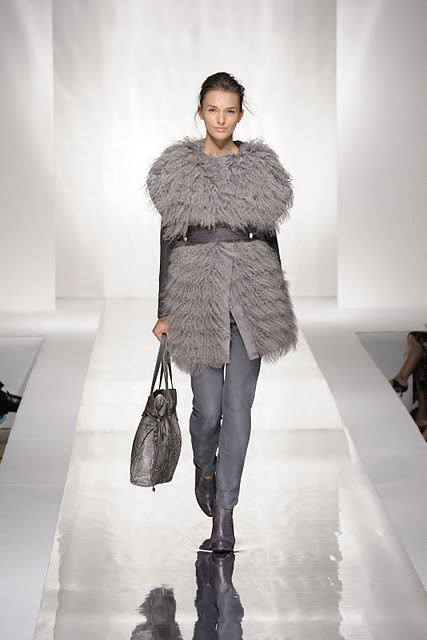 Woman wearing grey fur fashion coat