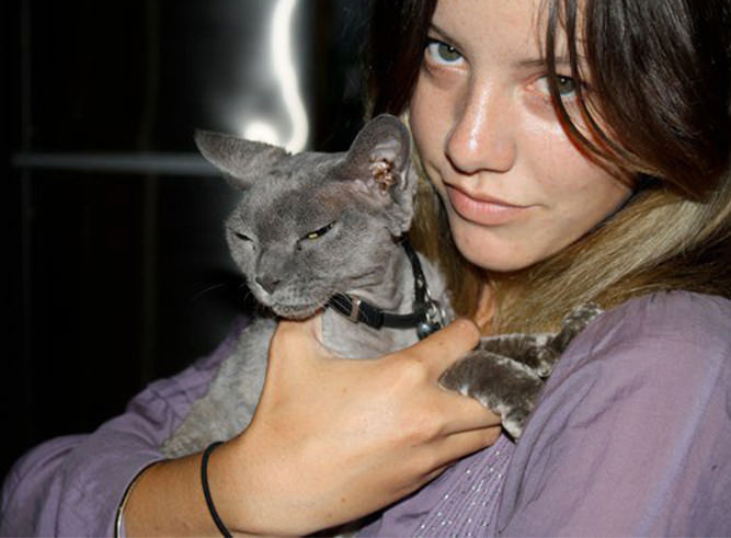 Blonde girl and grey cat